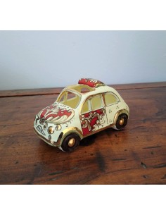 Little car in gold and ruby